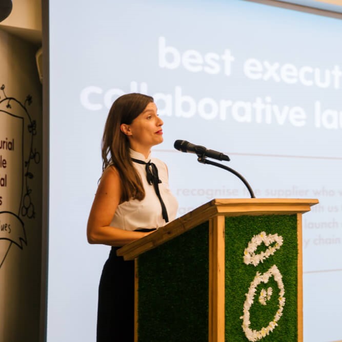 woman speaking on a microphone