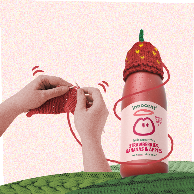 knitting a strawberry hat on a innocent smoothie bottle for the big knit